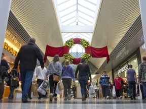 Shoppers walk through White Oaks Mall as the clock ticks down on holiday shopping, in this Free Press file photo.