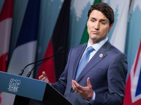 In this file photo taken on June 9, 2018, Prime Minister Justin Trudeau addresses a press conference at the conclusion of the G7 summit in La Malbaie, Quebec.