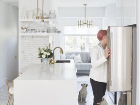 Jo Alcorn went trendy with a herringbone style floor, using a classic and timeless marble tile to balance the look. For the countertop, she went with a waterfall island  that is the centre of attention in the kitchen.