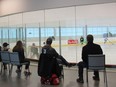 Parents watch their kids play hockey at the Bostwick Community Centre on Sunday, while sitting on some chairs provided by staff at the facility. After weeks of delays, the city is expected to install the ice pads’ seating in early 2019. (JONATHAN JUHA, The London Free Press)