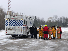 Emergency personnel, including police, paramedics and firefighters, are seen at a Southdale Road West address, west of Wonderland Road South, Tuesday morning. They were part of a search for a man who has been found safe. (Photo by JONATHAN JUHA, The London Free Press)