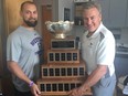 Western Mustangs offensive co-ordinator Steve Snyder, left, and head coach Greg Marshall hold the Vanier Cup the team won in 2017. (Morris Dalla Costa/Postmedia Network)
