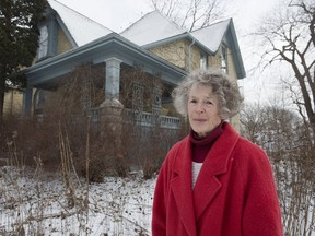 Nan Finlayson stands in front of her 120-year-old house at 100 Stanley St. (Derek Ruttan/The London Free Press)