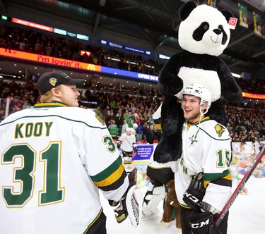 Knights forward Cole Tymkin shows off a huge teddy bear to Jordan Kooy after Knights' defenceman Adam Boqvist scored late in the first period of their game unleashing the teddy bear toss during their game against the Sarnia Sting at Budweiser Gardens on Sunday December 2, 2018. 
Mike Hensen/The London Free Press/Postmedia Network