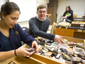 Damla Alper and Anthony Dicecca of Western study for a petrology exam in their lab.  A recent Stats Can report shows that recent male grads made significantly more than their female counterparts. (Mike Hensen/The London Free Press)