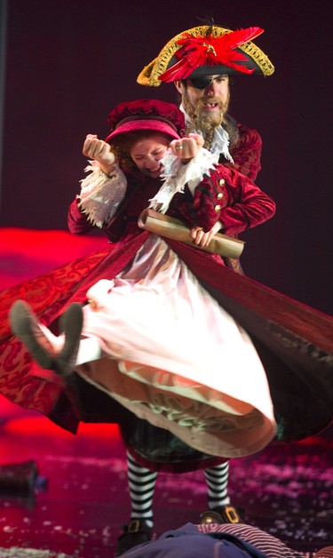 Riley DeLuca playing the youngest version of Scrooge in the the Grand Theatre's production of A Christmas Carol, has a fantasy battle with pirates from one of the books she read. Pirate played by Aiden de Salaiz. Photograph taken on Wednesday December 5, 2018.  Mike Hensen/The London Free Press/Postmedia Network