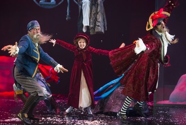 Riley DeLuca playing the youngest version of Scrooge in the the Grand Theatre's production of A Christmas Carol, has a fantasy battle with pirates from one of the books she read. Pirates played by Sean Arbuckle and Aiden de Salaiz. Photograph taken on Wednesday December 5, 2018.  Mike Hensen/The London Free Press/Postmedia Network