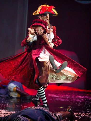 Riley DeLuca playing the youngest version of Scrooge in the the Grand Theatre's production of A Christmas Carol, has a fantasy battle with pirates from one of the books she read. Pirate played by Aiden de Salaiz. Photograph taken on Wednesday December 5, 2018.  Mike Hensen/The London Free Press/Postmedia Network