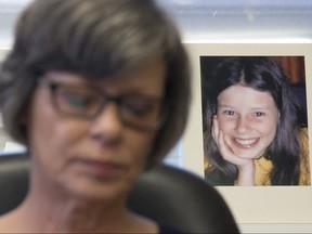 With an image of her 12-year-old self behind her, Irene Deschenes held a press conference to announce that she has won a court challenge to re-open a civil suit against the Catholic Church that was originally settled in 2000. The photo behind her was taken by her abuser, Catholic priest Charles Sylvestre. Photo shot in Strathroy, Ont. on Thursday December 6, 2018. Derek Ruttan/The London Free Press/Postmedia Network