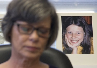 With an image of her 12-year-old self behind her, Irene Deschenes held a press conference to announce that she has won a court challenge to re-open a civil suit against the Catholic Church that was originally settled in 2000. The photo behind her was taken by her abuser, Catholic priest Charles Sylvestre. Photo shot in Strathroy, Ont. on Thursday December 6, 2018. Derek Ruttan/The London Free Press/Postmedia Network