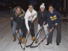 Dianne Arnold, left, Ethan Hickey, Katie Gutteridge and Becky Seagram will participate an annual road hockey game on Devonshire Avenue tomorrow, the finale of its 14-year run. (Derek Ruttan/The London Free Press)