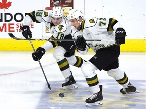 Liam Foudy passes the puck as he and London Knights teammate Alec Regula rush toward the Kingston Frontenacs end during the first period of their OHL game at Budweiser Gardens in London on Friday, Dec. 7, 2018. (Derek Ruttan/The London Free Press)