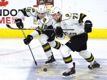Liam Foudy passes the puck as he and London Knights teammate Alec Regula rush toward the Kingston Frontenacs end during the first period of their OHL game at Budweiser Gardens in London on Friday night. Foudy scored one of the goals as the Knights won 8-1. Derek Ruttan/The London Free Press/Postmedia Network