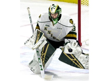 London Knights goalie Joesph Raaymakers makes a glove save during the first period of the OHL game against the Kington Frontenacs at Budweiser Gardens in London on Friday night. Raaymakers stopped all but one shot in an 8-1 victory. Derek Ruttan/The London Free Press/Postmedia Network