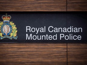 The RCMP logo is seen outside Royal Canadian Mounted Police "E" Division Headquarters, in Surrey, B.C., on Friday April 13, 2018. Nova Scotia RCMP says they are continuing to look for answers in the death of a 22-year-old woman on the We'koqma'q (Waycobah) First Nation in October. THE CANADIAN PRESS/Darryl Dyck ORG XMIT: CPT127