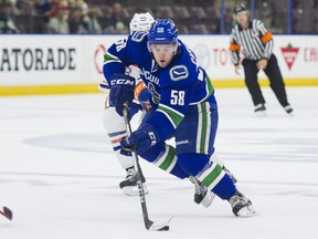 Vancouver Canucks Michael Carcone skates in alone on the Edmonton Oilers net during NHL preseason hockey action September, 11, 2017. (Richard Lam/Postmedia)