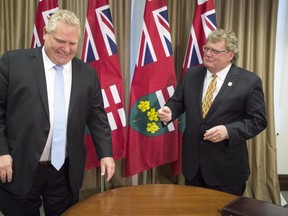 Ontario Premier Doug Ford meets with London Mayor Ed Holder in Toronto on Monday December 10, 2018. THE CANADIAN PRESS/Frank Gunn