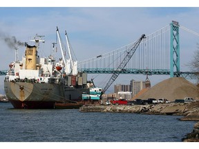 Workers on the freighter Vamand Wave use a crane to unload a massive cargo of stone on the West Windsor waterfront. Great Lakes cargo shipping, led by movement of road salt and grain, enjoyed a strong season in 2018. (Postmedia file photo)