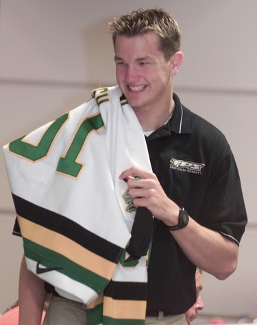 **TorSun Photo** June 21, 2002 - Top N.H.L. prospect Rick Nash, walks with a jersey slung over his shoulder at the Top Prospects Media Luncheon held at the M.T.C.C. SUNDIGI photo/Ernest Doroszuk. Original Filename was Rick-4.jpg Processed: Friday, June 21, 2002 6:29:58 PM