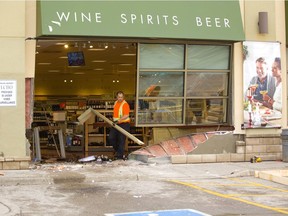A vehicle struck an LCBO near the intersection of Clarke Road and Dundas Street on Tuesday, January 1, 2019. Workers were busy sweeping up the broken glass and bottles as well as framing up a new section of wall to replace the portion damaged by the collision. (Mike Hensen/The London Free Press)
