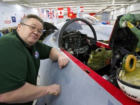 Scott Ellinor, president of the Jet Aircraft Museum poses with a T-33 under construction at their London airport location.  The museum hopes to purchase a Canadair Tutor, like the one's made famous by the Snowbirds, to add to their collection.  (Mike Hensen/The London Free Press)