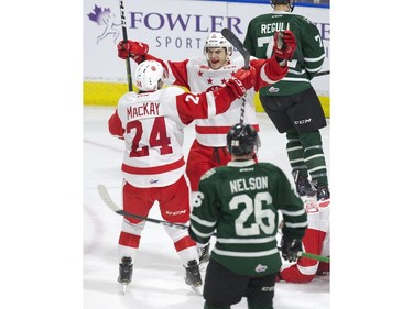 Cole MacKay and Jacob LeGuerrier of the Sault Ste. Marie Greyhounds celebrate after LeGuerrier tied the score at 1-1 in the first period of their OHL game against the London Knights in London, Ont. on Friday January 4, 2019. Derek Ruttan/The London Free Press/Postmedia Network