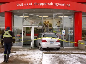A small car drove through the glass entranceway to Shoppers Drug Mart on Adelaide Street South and Southdale Road on Monday January 7, 2019.  (MIKE HENSEN, The London Free Press)