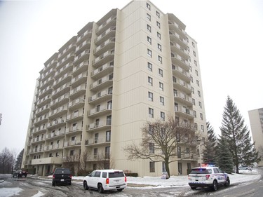 Three police vehicles, two unmarked, arrived at the scene of a home invasion at a Wonderland Road North apartment complex in London on Wednesday. (Derek Ruttan/The London Free Press)