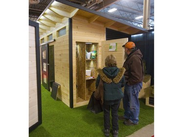 Mary and Brad Zimmer of London inspect a shed made by Backyard Escape Studios in London, while they were visiting the Lifestyle Homeshow at the Western Fair Agriplex  in London Friday. (Mike Hensen/The London Free Press)