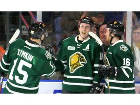 Liam Foudy of the Knights is congratulated by Cole Tymkin and Kevin Hancock after he opened the scoring Friday night with a tip past Windsor's Kari Piiroinen during the first period of their OHL game at Budweiser Gardens. Photo taken Jan. 25, 2019.  (MIKE HENSEN, The London Free Press)