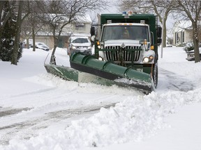 A City of London snow plow clears residential streets in this file photo.