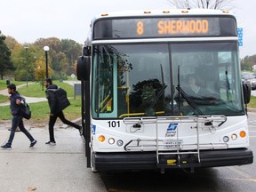 People step off a Sarnia bus stopped at Lambton College. (Tyler Kula/Postmedia Network)