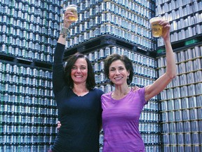 Cheryl Shillington, owner of Yoga Glow Studio, and Nicole Baggs pose with cups of beer at Sons of Kent Brewing Co. in Chatham Jan. 14, 2019. Shillington is hosting a Bend and Beer Hoppy Hour Yoga at the brewery Jan. 20.
