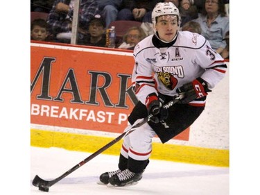 Owen Sound Attack Nick Suzuki carries the puck during first-period action of game five of OHL Western Conference semi-final series at Essar Centre in Sault Ste. Marie, Ont. on Friday, April 13, 2018. (BRIAN KELLY/Postmedia News)