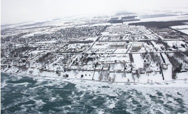 Canadian Coast Guard icebreakers rely on helicopters to see the extent of ice cover in the St. Clair River. Corunna is pictured from the air Tuesday. Tyler Kula/Sarnia Observer/Postmedia Network