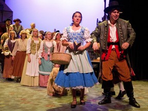 Belle, played by Alicia D’Ariano, can’t hide her feelings as she moves away from the swaggering Ben Kennes, who plays Gaston in the London Community Players production of Disney’s Beauty and the Beast. (Mike Hensen/The London Free Press)