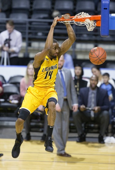The London Lightning's Marcus Capers slams home two points during their NBL game against the Moncton Magic in London on Thursday. (Derek Ruttan/The London Free Press)