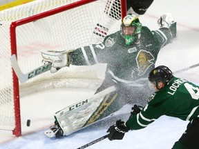 Joseph Raaymakers, of the London Knights, can't get across quickly enough as Guelph Storm's Dominico Commisso (not seen) converts a pass from Cedric Ralph for the first goal of the game during their Tuesday night game at Budweiser Gardens.  Mike Hensen/The London Free Press