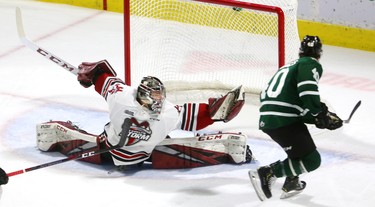 Anthony Popovich of the Guelph Storm has to stretch all the way to make a glove save on Antonio Stranges of the London Knights during their Tuesday night game at Budweiser Gardens.  Mike Hensen/The London Free Press