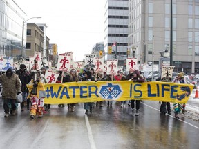 Hundreds of people protested against oil pipelines being built in Canada in London on Wednesday. The group shut down several intersections in the downtown during the hour-long demonstration. (Derek Ruttan/The London Free Press)