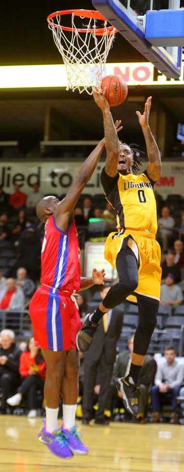 Maurice Bolden of the Lightning didn't have a lot of success going against George Williams of the Cape Breton Highlanders in the first half of their NBL game at Budweiser Gardens in London, Ont.  Photograph taken on Thursday January 10, 2019.  Mike Hensen/The London Free Press/Postmedia Network