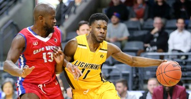 Jaylen Babb-Harrison of the Lightning works around the baseline on George Williams of the Cape Breton Highlanders in the first half of their NBL game at Budweiser Gardens in London, Ont.  Photograph taken on Thursday January 10, 2019.  Mike Hensen/The London Free Press/Postmedia Network