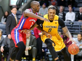 Maurice Bolden of the London Lightning works around the baseline on Oluyuima Famutimi of the Cape Breton Highlanders during the first half of their NBL game at Budweiser Gardens in London Thursday Jan. 10, 2019.  Mike Hensen/The London Free Press