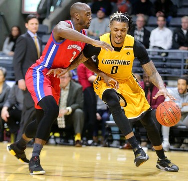 Maurice Bolden of the Lightning works around the baseline on Oluyuima Famutimi of the Cape Breton Highlanders in the first half of their NBL game at Budweiser Gardens in London, Ont.  Photograph taken on Thursday January 10, 2019.  Mike Hensen/The London Free Press/Postmedia Network