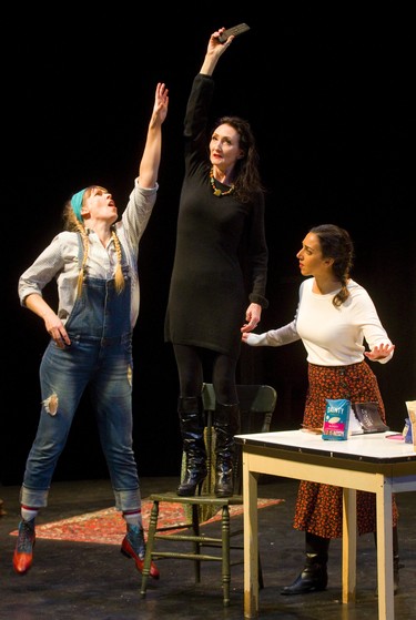 Younger sister Kelly Creighton as Louise tries to grab the TV remote from her older sister Agnes, played by Charlene McNabb while middle sister Maya Gupta as Theresa hovers, during a scene in the play Marion Bridge at the McManus theatre in London, Ont.  Photograph taken on Sunday January 13, 2019.  Mike Hensen/The London Free Press/Postmedia Network