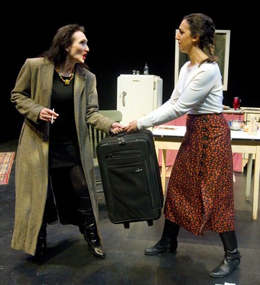 Charlene McNabb as the older sister Agnes, and Maya Gupta as the middle sister Theresa fight over a simple suitcase in a scene from the play Marion Bridge at the McManus theatre in London, Ont.  Photograph taken on Sunday January 13, 2019.  Mike Hensen/The London Free Press/Postmedia Network