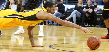 Josiah Moore of the Lightning dives for a loose ball under the Saint John Riptide during their Sunday afternoon game at Budweiser Gardens in London, Ont. The Lightning fell 107-98 against the Riptide who were 4-12 entering the game.
Photograph taken on Sunday January 13, 2019. 
Mike Hensen/The London Free Press/Postmedia Network