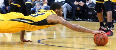 Josiah Moore of the Lightning dives for a loose ball under the Saint John Riptide during their Sunday afternoon game at Budweiser Gardens in London, Ont. The Lightning fell 107-98 against the Riptide who were 4-12 entering the game.
Photograph taken on Sunday January 13, 2019. 
Mike Hensen/The London Free Press/Postmedia Network