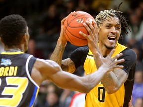 Maurice Bolden of the Lightning picks the ball up on his drive against Jeremiah Mordi of the Saint John Riptide during their Sunday afternoon game at Budweiser Gardens in London, Ont. The Lightning fell 107-98 against the Riptide who were 4-12 entering the game.
Photograph taken on Sunday January 13, 2019. 
Mike Hensen/The London Free Press/Postmedia Network