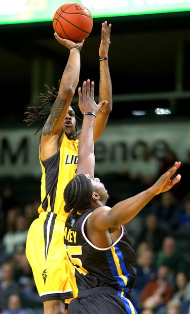 Another jumper by Anthony "AJ" Gaines of the Lightning over Frank Bartley of the Saint John Riptide during their Sunday afternoon game at Budweiser Gardens in London, Ont. The Lightning fell 107-98 against the Riptide who were 4-12 entering the game.
Photograph taken on Sunday January 13, 2019. 
Mike Hensen/The London Free Press/Postmedia Network